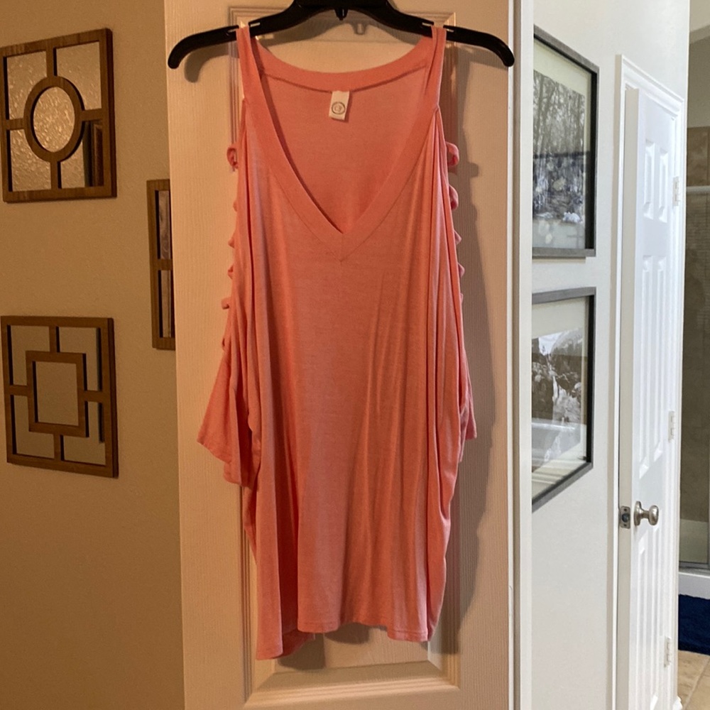 Peach colored top with cut out shoulders
